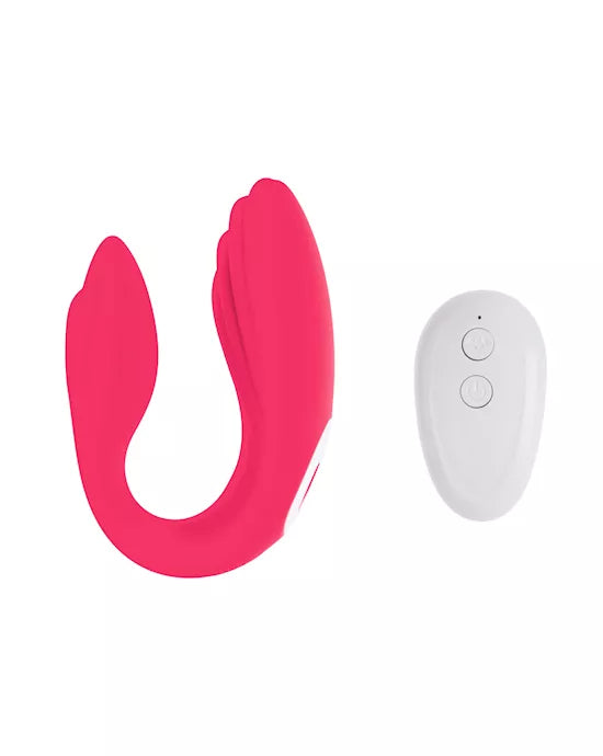 Pink remote-controlled couples vibrator with a sleek design and a white control panel.