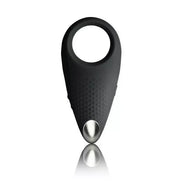 Black vibrating cock ring with textured surface and silver accent, designed for enhanced pleasure.