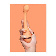 Vush Abbie G-Spot vibrator held in a hand, featuring a smooth orange design and ergonomic shape.