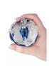 Nood Colours masturbator in hand, featuring a textured, translucent design with blue and silver colors.