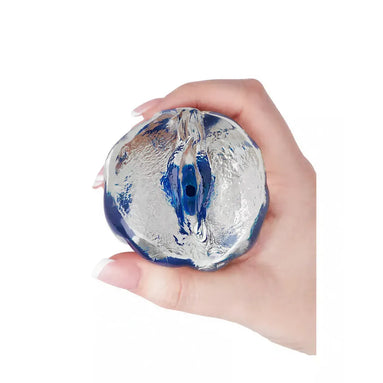Nood Colours masturbator in hand, featuring a textured, translucent design with blue and silver colors.