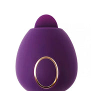 Dana clitoral stimulator in purple silicone with a rounded design and gold accent ring.