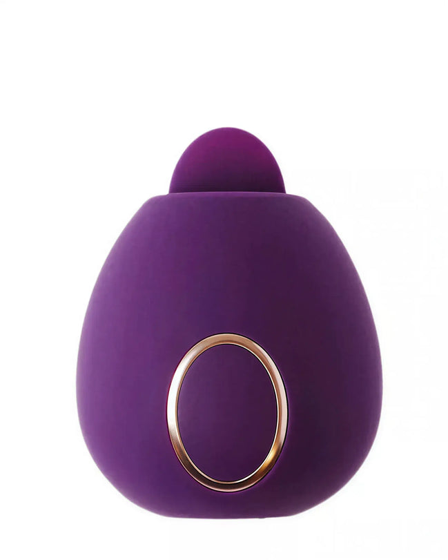Dana clitoral stimulator in purple silicone with a rounded design and gold accent ring.