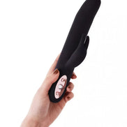 Ruslan rocking and gyrating rabbit in black silicone, held in a hand, featuring three control buttons.