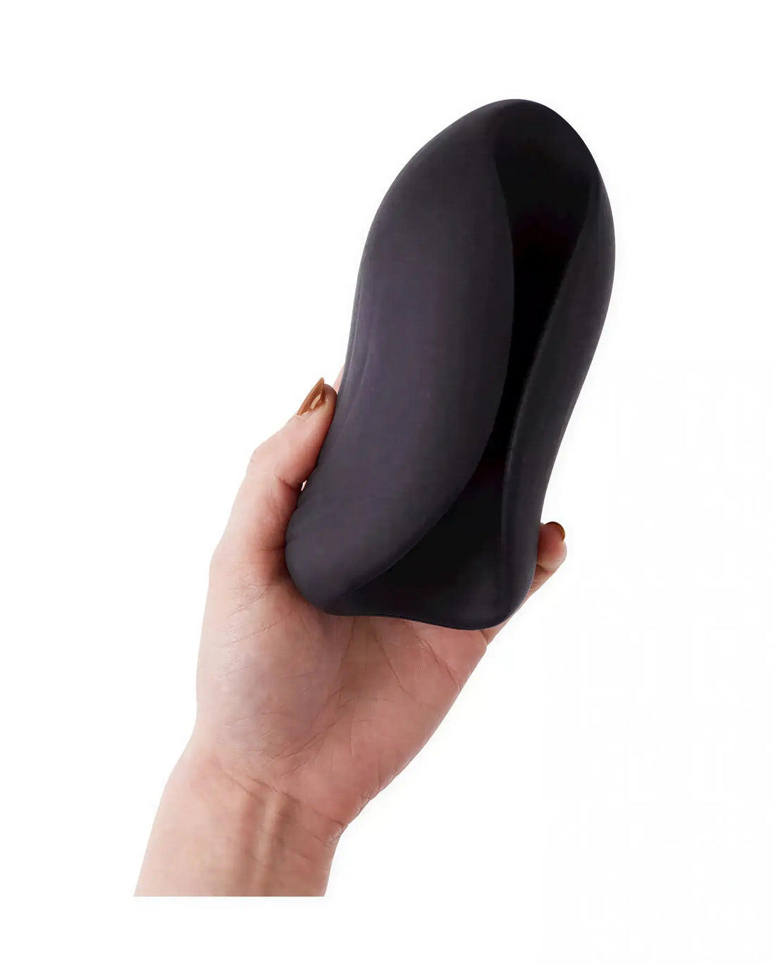 Jeron vibrating stroker held in a hand, featuring a sleek black design with a smooth, curved shape.