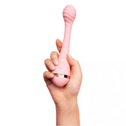 Vush Myth G-Spot vibrator in pink held by a hand, featuring a curved design and textured tip for stimulation.