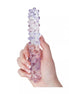 Lucent velour beaded glass massager held in a hand, featuring a clear body with purple and lavender beads.
