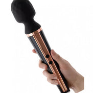 Tarah wand vibrator with a black silicone head and a sleek rose gold handle, held in a hand.