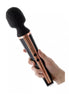 Tarah wand vibrator with a black silicone head and a sleek rose gold handle, held in a hand.