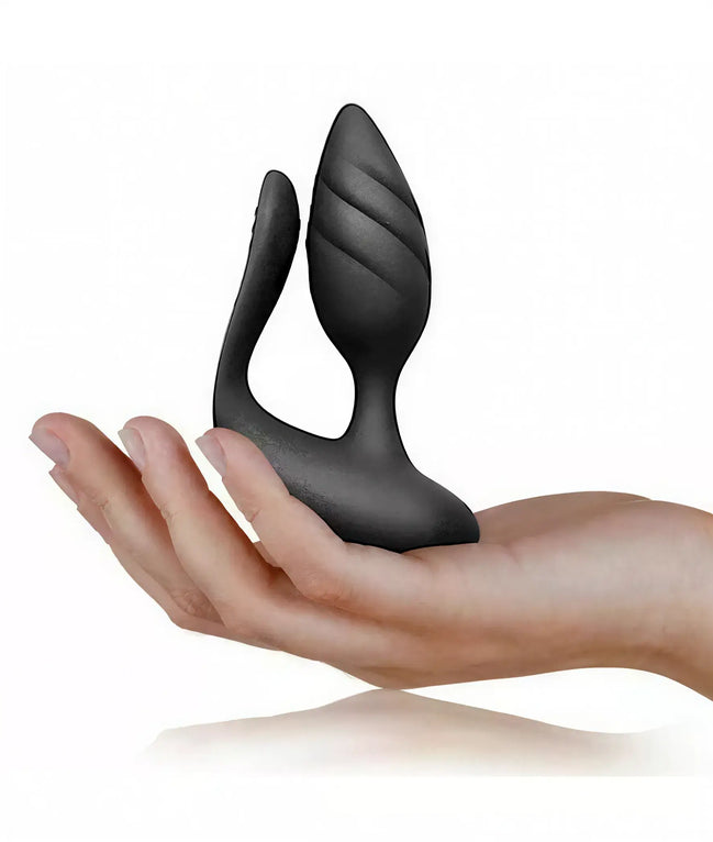 Rocks Off Cocktail vibrating pleasure in a hand, featuring a sleek black design with curved contours.