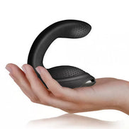 Rocks Off Rude Boy Xtreme prostate vibrator held in a hand, featuring a curved design and textured surface.