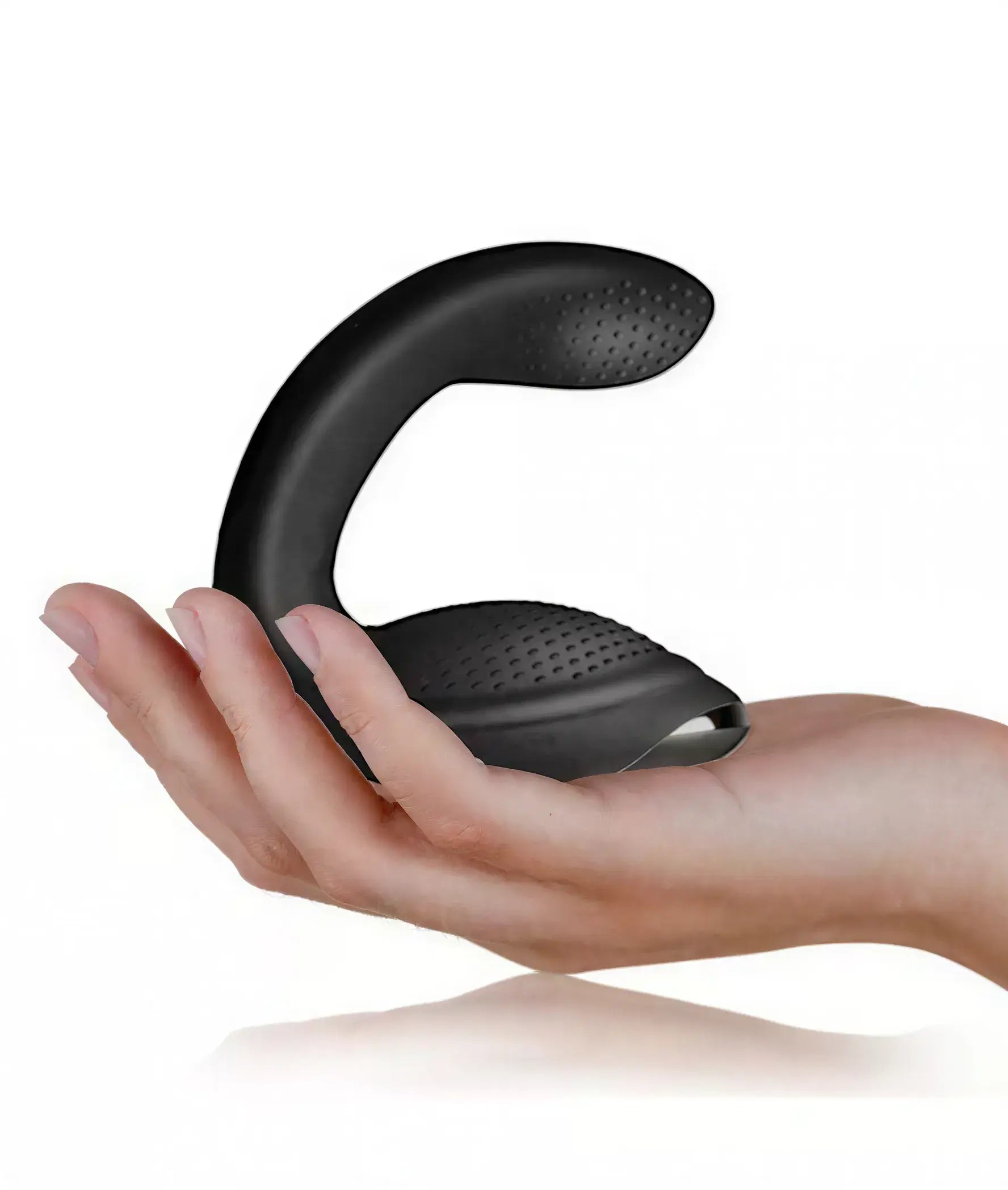 Rocks Off Rude Boy Xtreme prostate vibrator held in a hand, featuring a curved design and textured surface.