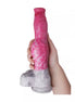 Kinki Canine Monster Dildo in pink and gray, held in a hand, featuring a textured design and a sturdy base.