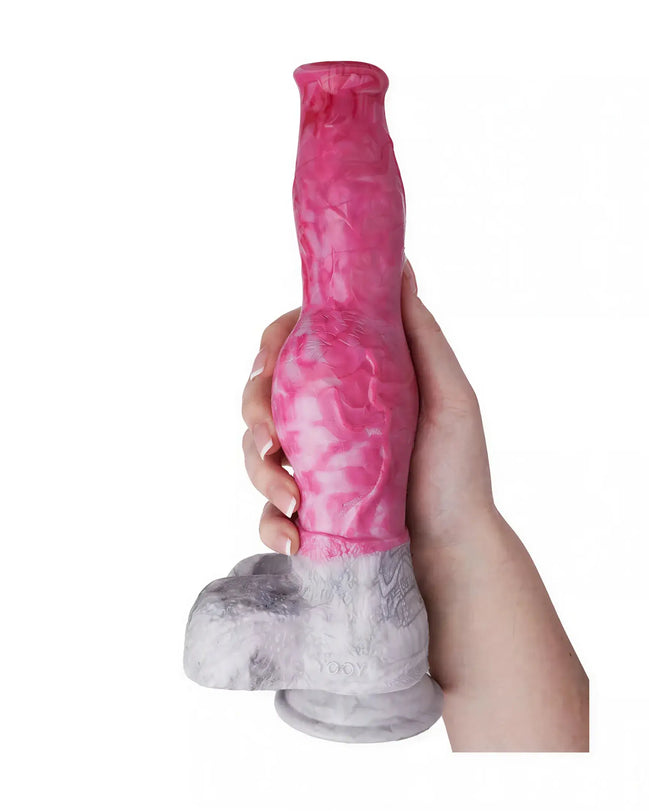 Kinki Canine Monster Dildo in pink and gray, held in a hand, featuring a textured design and a sturdy base.