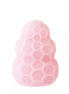 Reversible honey stroker in soft pink silicone with a honeycomb texture and rounded top.