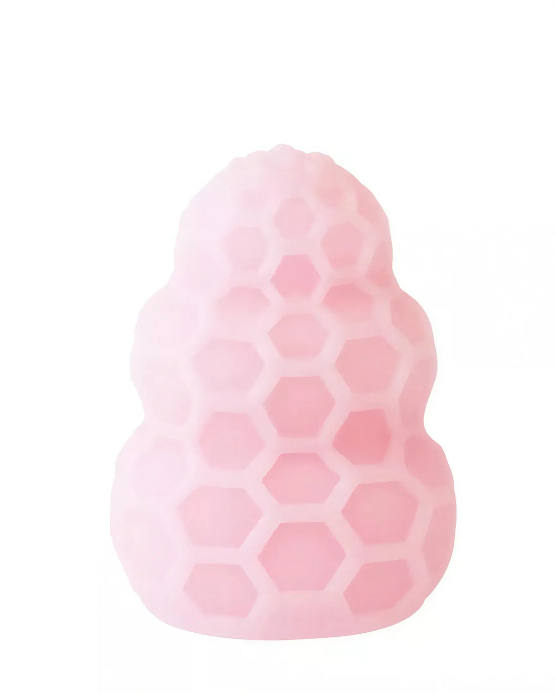 Reversible honey stroker in soft pink silicone with a honeycomb texture and rounded top.