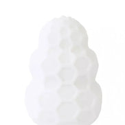 Reversible honey stroker in white silicone with a honeycomb texture, designed for enhanced grip and stimulation.