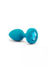 B-Vibe vibrating jewel plug in turquoise silicone with a blue gem accent, showcasing a tapered design.