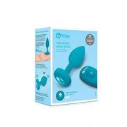 B-Vibe vibrating jewel plug in teal packaging with a remote control and product details visible on the box.
