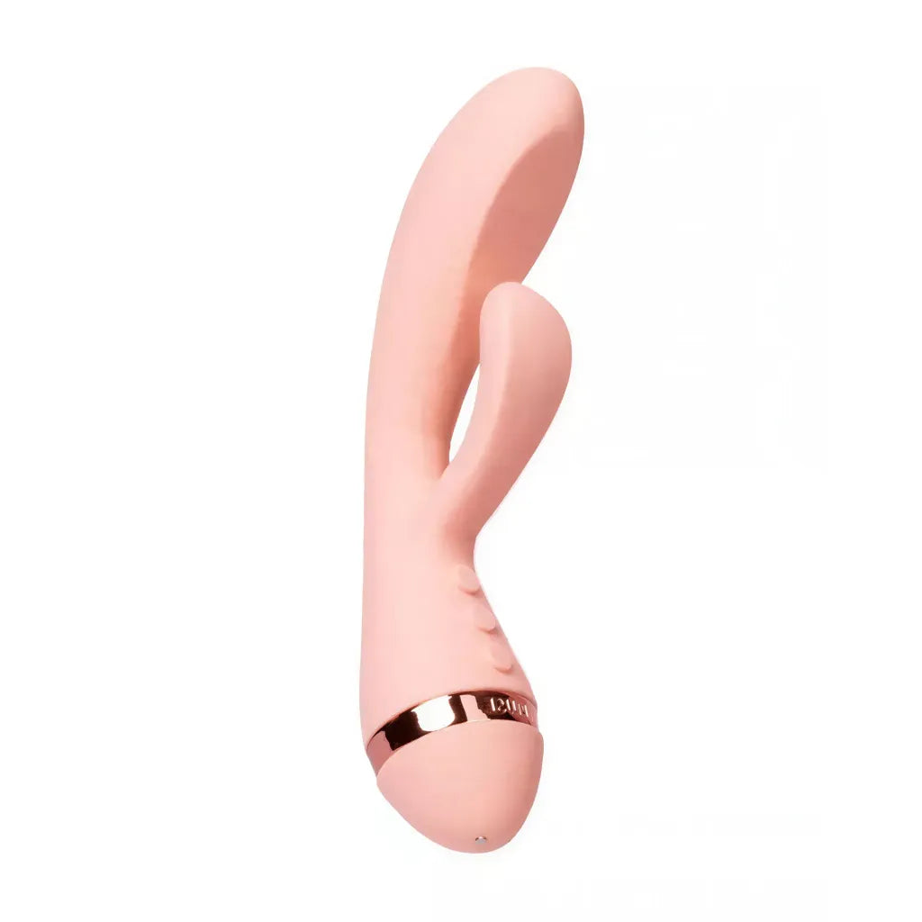 Vush Muse Rabbit Vibrator in soft pink with a gold band and dual stimulation design, angled view showcasing its shape.