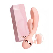 Vush Muse rabbit vibrator in soft pink with dual stimulation features and a sleek packaging box.