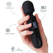 Ema Mini Digital Wand in black, held in a hand, featuring a digital display and USB rechargeable design.