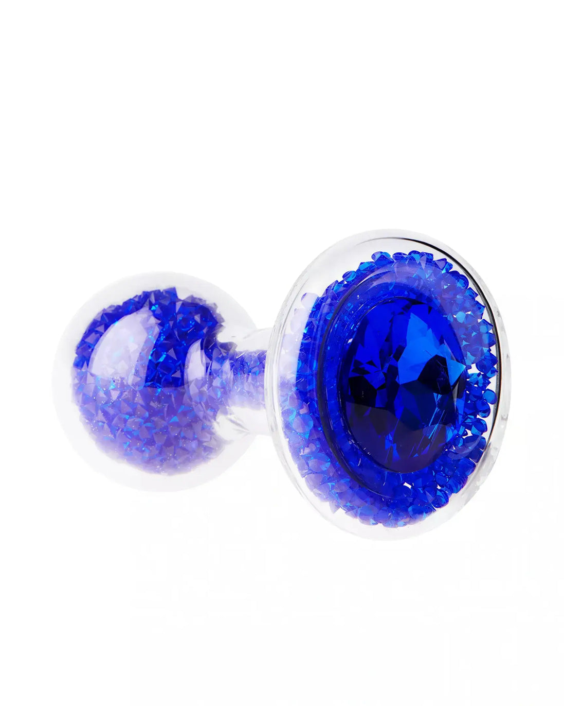 Lucent glass butt plug with a blue gem and sparkling blue crystals, featuring a clear body and rounded base.