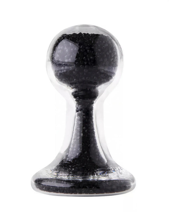 Lucent glass butt plug in black, featuring a rounded top and tapered base, with a transparent outer layer.