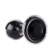 Lucent glass butt plug in black with a faceted gem base, showcasing a smooth, glossy surface.