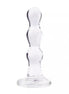 Lucent Utopia glass bead butt plug with a clear, smooth design and a flared base for stability.