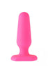 Pink silicone butt plug with a tapered shape and a wide base for stability.