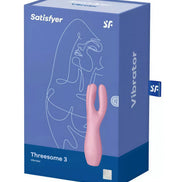 Satisfyer Threesome 3 vibrator in a pink color, displayed in a blue box featuring line art design.