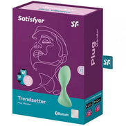 Satisfyer Trendsetter plug vibrator in a purple box featuring a minimalist face design and Bluetooth compatibility.