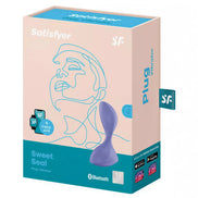 Satisfyer Sweet Seal plug vibrator in a light pink box with a minimalist design and blue accents, featuring app connectivity.