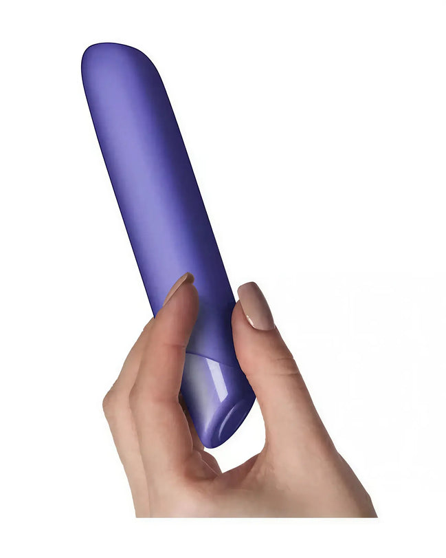 Rocks Off Sugarboo Veri Peri bullet vibrator held in a hand, featuring a smooth purple design and tapered tip.