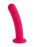 Pink silicone dildo on a white background