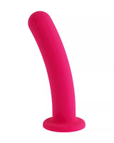 Pink silicone dildo on a white background