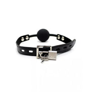 Black ball gag with padlock, featuring a smooth round ball and adjustable leather strap with metal buckle.
