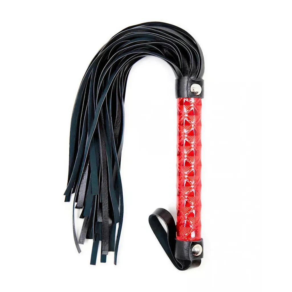 Black leather BDSM whip with a red handle on a white background