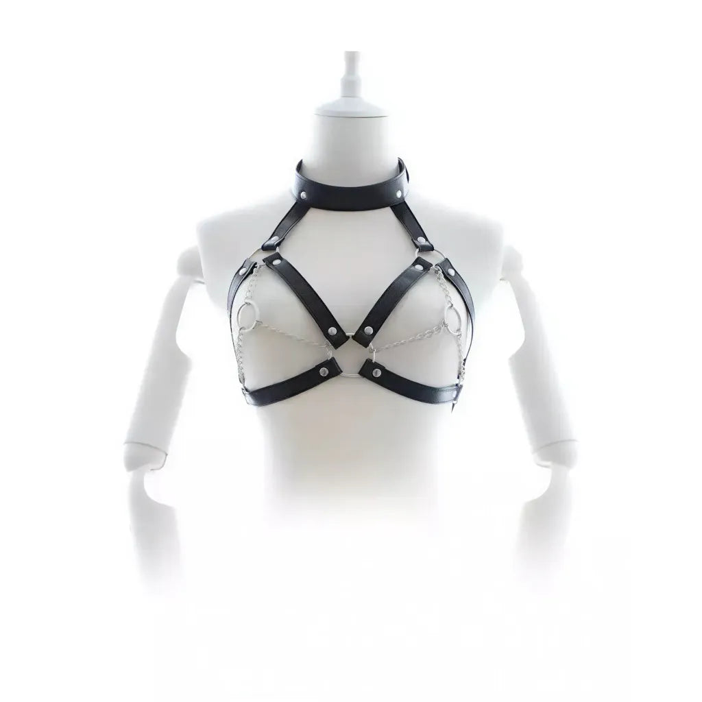 Black leather harness on a mannequin against a white background