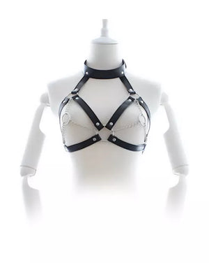 Black leather harness on a mannequin against a white background