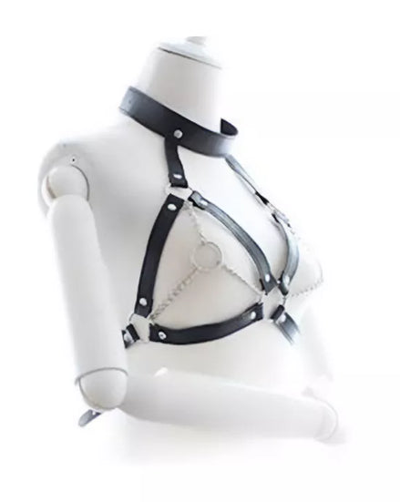 Black leather harness on a mannequin bust against a white background