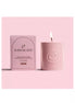 High On Love massage candle in a textured pink container with a matching box, featuring lychee scent.