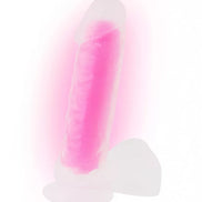 Nood Colours glow in the dark dildo, 8.1 inches, featuring a translucent pink body with a smooth texture.