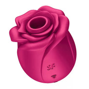 Satisfyer Pro 2 Classic Blossom in bright pink, shaped like a rose with a smooth finish and a control button at the base.