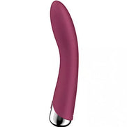 Satisfyer Spinning Vibe 1 in a curved design, featuring a smooth burgundy silicone body and a metallic base.