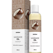 Satisfyer coconut massage oil in a 250ml bottle with a brown and white label, displayed beside its packaging.