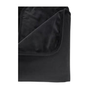 Pivot Protector waterproof blanket in black, showcasing a folded corner with soft, plush texture.