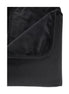 Pivot Protector waterproof blanket in black, showcasing a folded corner with soft, plush texture.
