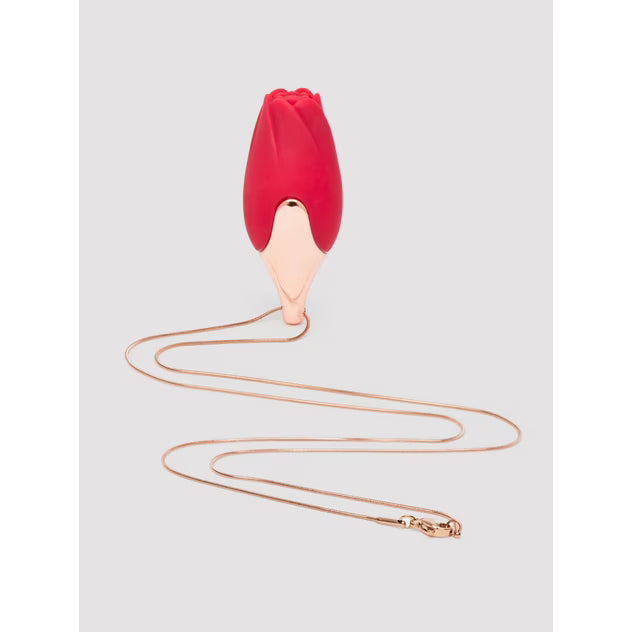 Patina necklace vibrator in red with a gold chain, designed to resemble a flower bud.